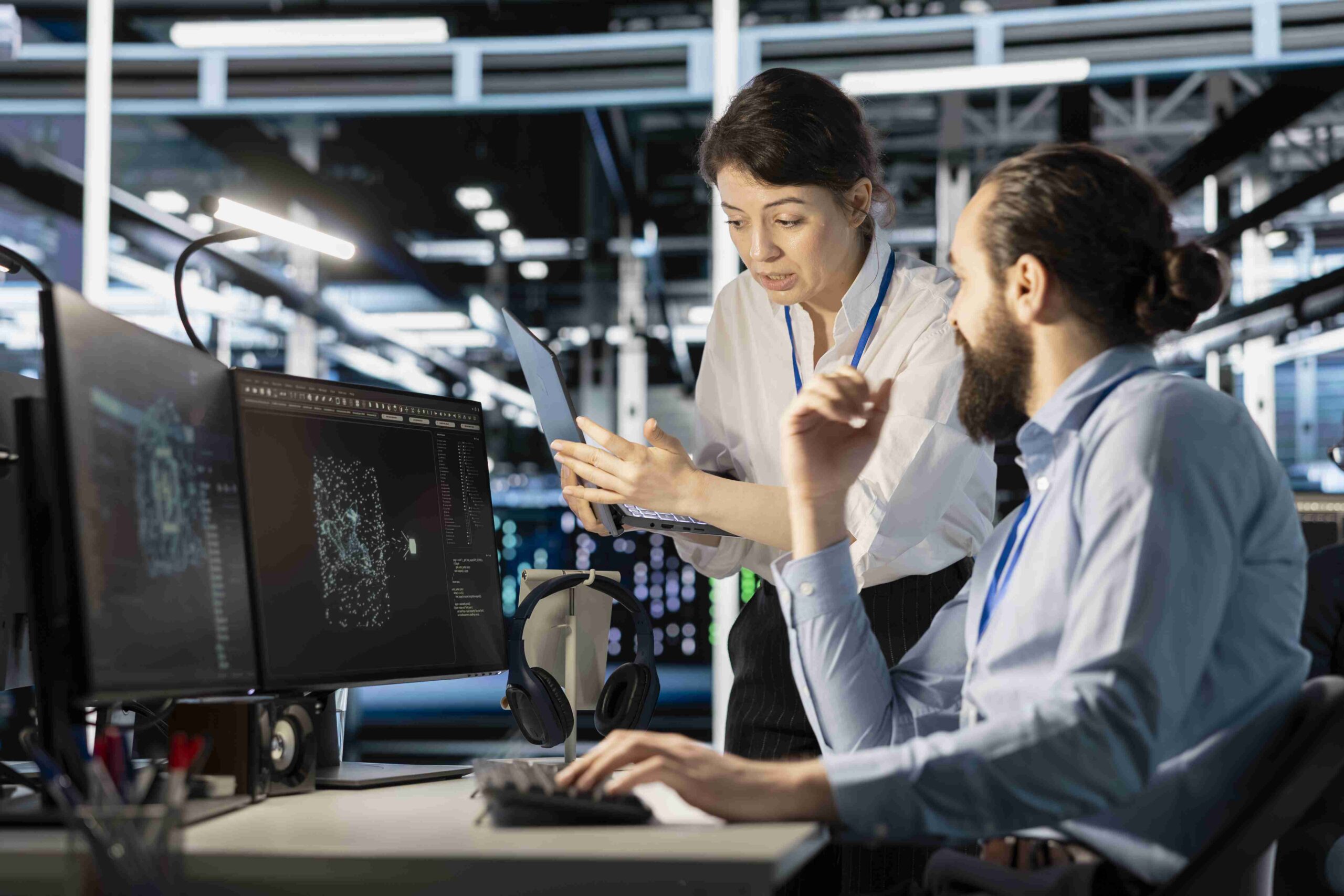 Engineering team doing brainstorming in server hub, using AI powered tech to run simulations. Data center coworkers cooperating, coding algorithms to extract insights from data and automate rigs